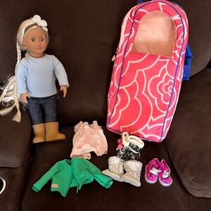Our Generation doll with clothes and carrying case!